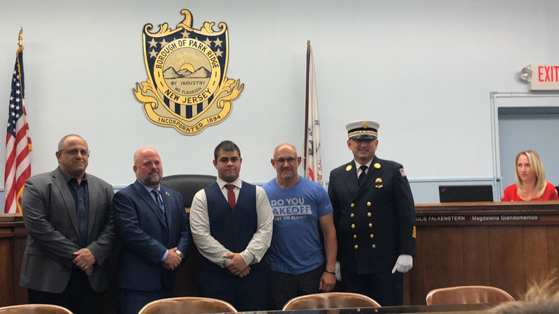 A junior at Community High School sworn in as a Volunteer Junior Firefighter in Park Ridge, New Jersey